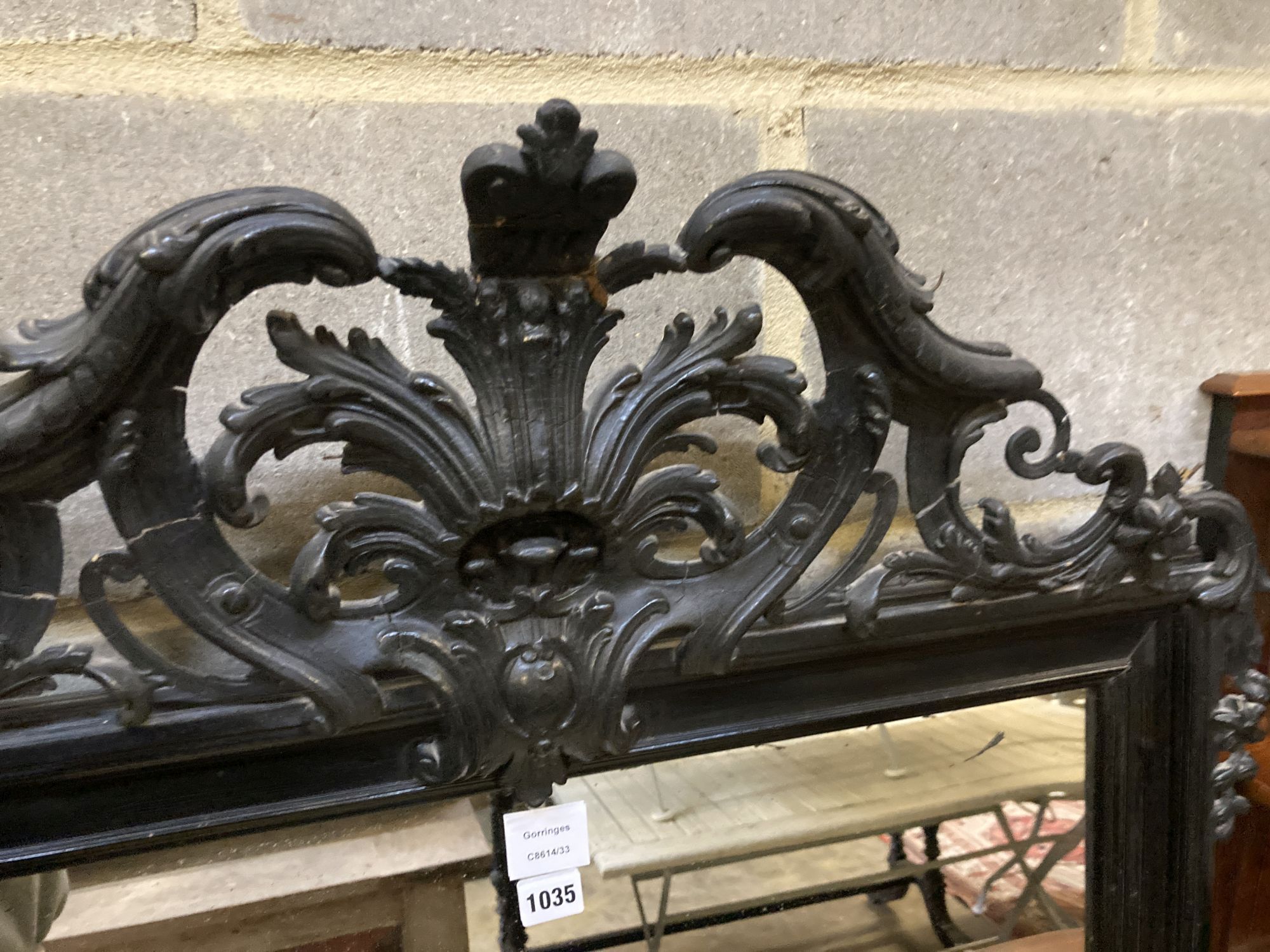 A 19th century French ebonised wall mirror, width 86cm, height 158cm